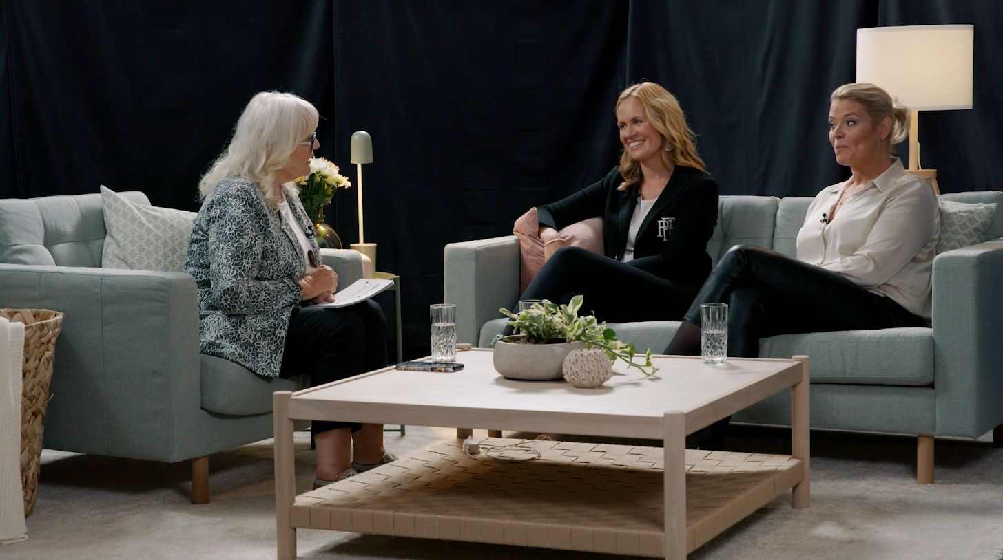 Three women sitting on couches