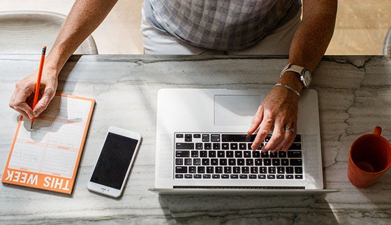 overhead view of man using laptop