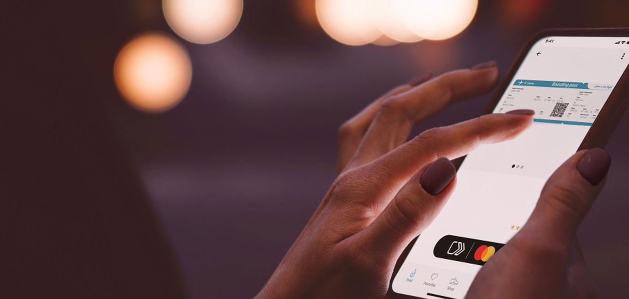 hands holsing a smartphone using an app
