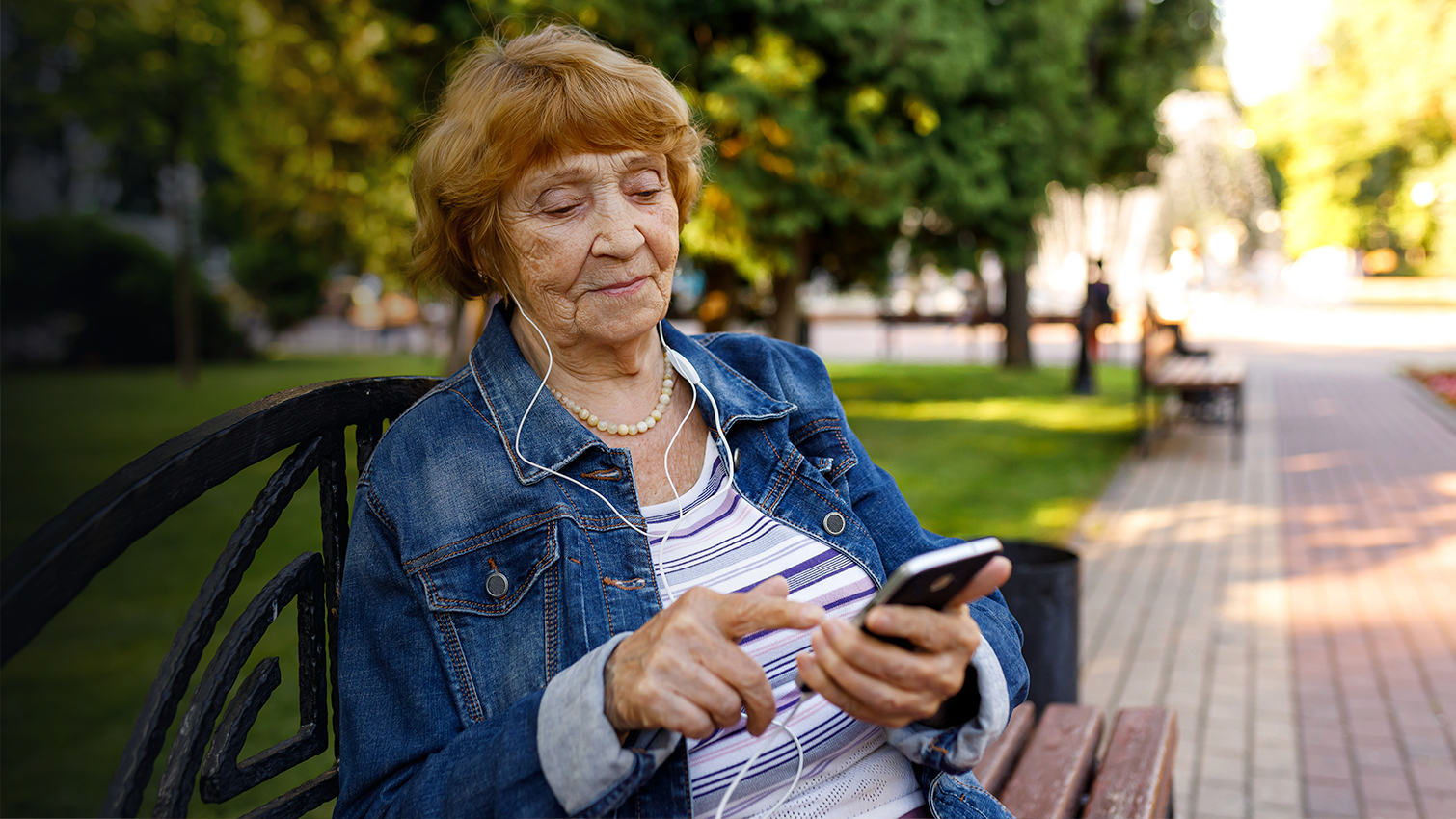 older woman holding a smartphone